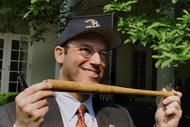 388779 03: White House spokesman Ari Fleischer holds a bat autographed by the New York Yankees baseball team May 4, 2001 in the Rose Garden of the White House. President George W. Bush was hosting a White House visit by the World Series champion New York Yankees. (Photo by Mark Wilson/Newsmakers)