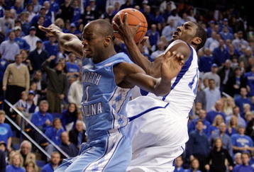 LEXINGTON, KY - DECEMBER 05:  John Wall #11 of the Kentucky Wildcats shoots the ballwhhile defended by Marcus Ginyard #1 of the North Carolina Tar Heels during the game on December 5, 2009 at Rupp Arena in Lexington, Kentucky. Kentucky won 68-66.  (Photo by Andy Lyons/Getty Images)