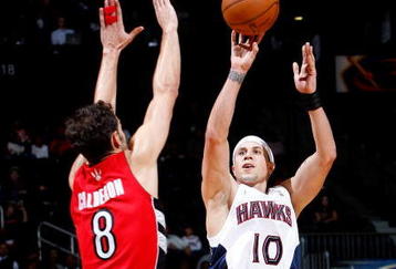 ATLANTA - DECEMBER 02:  Mike Bibby #10 of the Atlanta Hawks against Jose Calderon #8 the Toronto Raptors at Philips Arena on December 2, 2009 in Atlanta, Georgia.  NOTE TO USER: User expressly acknowledges and agrees that, by downloading and/or using this Photograph, User is consenting to the terms and conditions of the Getty Images License Agreement.  (Photo by Kevin C. Cox/Getty Images)