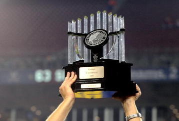 TAMPA, FL - NOVEMBER 28:  Coach Paul Johnson of the Georgia Tech Yellow Jackets holds the championship trophy aloft after play against the Clemson Tigers in the 2009 ACC Football Championship Game December 5, 2009 at Raymond James Stadium in Tampa, Florida.  (Photo by Al Messerschmidt/Getty Images)