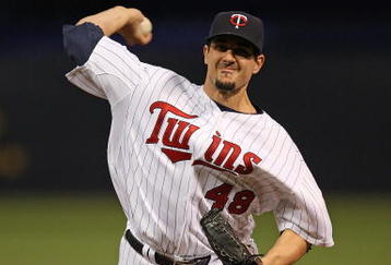 MINNEAPOLIS - OCTOBER 11: Carl Pavano #48 of the Minnesota Twins delivers the ball against the New York Yankees in Game Three of the ALDS during the 2009 MLB Playoffs at the Hubert H. Humphrey Metrodome on October 11, 2009 in Minneapolis, Minnesota. (Photo by Jonathan Daniel/Getty Images)