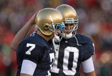 SOUTH BEND, IN - OCTOBER 17: Jimmy Clausen #7 of the Notre Dame Fighting Irish is consoled by teammate Dayne Crist #10 during a game against the USC Trojans at Notre Dame Stadium on October 17, 2009 in South Bend, Indiana. USC defeated Notre Dame 34-27. (Photo by Jonathan Daniel/Getty Images)
