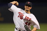 MINNEAPOLIS - OCTOBER 11: Carl Pavano #48 of the Minnesota Twins delivers the ball against the New York Yankees in Game Three of the ALDS during the 2009 MLB Playoffs at the Hubert H. Humphrey Metrodome on October 11, 2009 in Minneapolis, Minnesota. (Photo by Jonathan Daniel/Getty Images)