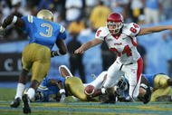 PASADENA, CA - SEPTEMBER 02:  Clint Mower #64 of the Utah Utes dives for a loose ball against the UCLA Bruins during the college football game held on Septemeber 2, 2006 at the Rose Bowl in Pasadena, California. The Bruins defeated the Utes 31-10. The Bruins defeated the Utes 31-10.  (Photo by Jeff Gross/Getty Images)