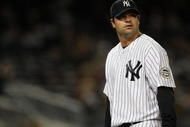 NEW YORK - SEPTEMBER 29:  Brian Bruney #99 of the New York Yankees looks up at the scoreboard during the game against the Kansas City Royals on September 29, 2009 at Yankee Stadium in the Bronx borough of New York City.  (Photo by Jared Wickerham/Getty Images)