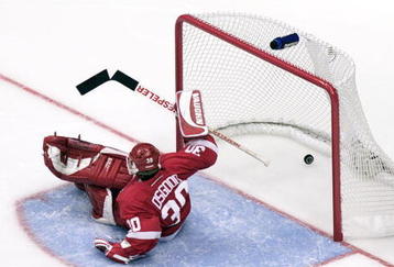 23 Apr 2001:  Goaltender Chris Osgood #30 of the Detroit Red Wings can''t stop the winning goal in overtime by Adam Deadmarsh #28 of the Los Angeles Kings in Game Six of the NHL Western Conference playoff quarterfinals at Staples Center in Los Angeles, California. DIGITAL IMAGE. Mandatory Credit: Donald Miralle/ALLSPORT