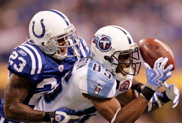 INDIANAPOLIS - DECEMBER 06:  Nate Washington #85 of the Tennessee Titans catches a pass while defended by Tim Jennings #23 of the Indianapolis Colts at Lucas Oil Stadium on December 6, 2009 in Indianapolis, Indiana.  (Photo by Andy Lyons/Getty Images)