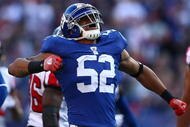 EAST RUTHERFORD, NJ - NOVEMBER 22: Michael Boley #52 of the the New York Giants celebrates after sacking quarterback Matt Ryan #2 of the Atlanta Falcons on November 22, 2009 at Giants Stadium in East Rutherford, New Jersey.  (Photo by Chris McGrath/Getty Images)
