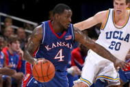 WESTWOOD, CA - DECEMBER 06: Sherron Collins #4 of the Kansas Jayhawks drives around Michael Roll #20 of the UCLA Bruins on December 6, 2009 at Pauley Pavillion in Westwood, California. Kansas won 73-61. (Photo by Stephen Dunn/Getty Images)