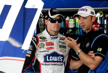 AVONDALE, AZ - NOVEMBER 13:  Jimmie Johnson (L) driver of the #48 Lowe's Chevrolet speaks with crew chief Chad Knaus (R) during practice for the NASCAR Sprint Cup Series Checker O'Reilly Auto Parts 500 at Phoenix International Raceway on November 13, 2009 in Avondale, AZ.  (Photo by Jason Smith/Getty Images for NASCAR)