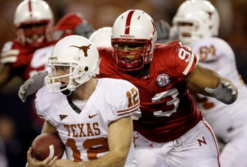 ARLINGTON, TX - DECEMBER 5:  Quarterback Colt McCoy #12 of the Texas Longhorns is sacked by Ndamukong Suh #93 of the Nebraska Cornhuskers in the first quarter of the game at Cowboys Stadium on December 5, 2009 in Arlington, Texas. (Photo by Jamie Squire/Getty Images)