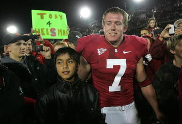 PALO ALTO, CA - NOVEMBER 28:  Toby Gerhart #7 of the Stanford Cardinal is congratulated by fans, with one holding a Toby 4 Heisman sign, after they beat the Notre Dame Fighting Irish at Stanford Stadium on November 28, 2009 in Palo Alto, California.  (Photo by Ezra Shaw/Getty Images)