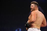 UNCASVILLE, CT - MAY 16:  Roy Nelson (White Trunks) of the Lions Den celebrates after beating Brad Imes MilesTech Fighting System during their bout presented by the International Fighting League at the Mohegan Sun Arena May 16, 2008 in Uncasville, Connecticut.  (Photo by Al Bello/Getty Images)