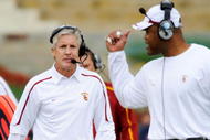 LOS ANGELES, CA - DECEMBER 05: Coach Pete Carroll (L) of the USC Trojans talks with Ken Norton Jr., Assistant Head Coach of the Defense/Linebackers during the foruth quarter of the NCAA college football game against Arizona Wildcats at the Los Angeles Coliseum on December 5, 2009 in Los Angeles, California. (Photo by Kevork Djansezian/Getty Images)