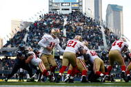 SEATTLE , WA - DECEMBER 06: Quarterback Alex Smith #11 of the San Francisco 49ers hands the ball off to Frank Gore #21 against the Seattle Seahawks at Qwest Field on December 6, 2009 in Seattle, Washington. (Photo by Jonathan Ferrey/Getty Images)