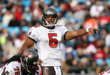 CHARLOTTE, NC - DECEMBER 06:  Josh Freeman #5 of the Tampa Bay Buccaneers calls a play against the Carolina Panthers at Bank of America Stadium on December 6, 2009 in Charlotte, North Carolina.  (Photo by Streeter Lecka/Getty Images)