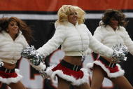 CINCINNATI, OH - DECEMBER 6: Cheerleaders for the Cincinnati Bengals cheers for their team against the Detroit Lions in their NFL game at Paul Brown Stadium December 6, 2009 in Cincinnati, Ohio.    (Photo by John Sommers II/Getty Images)