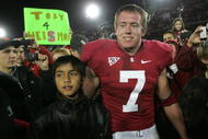 PALO ALTO, CA - NOVEMBER 28: Toby Gerhart #7 of the Stanford Cardinal is congratulated by fans, with one holding a Toby 4 Heisman sign, after they beat the Notre Dame Fighting Irish at Stanford Stadium on November 28, 2009 in Palo Alto, California. (Photo by Ezra Shaw/Getty Images)