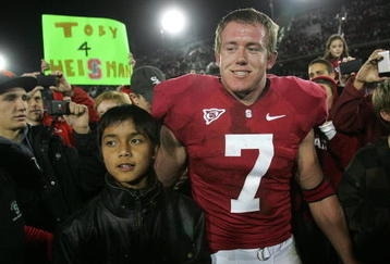 PALO ALTO, CA - NOVEMBER 28:  Toby Gerhart #7 of the Stanford Cardinal is congratulated by fans, with one holding a Toby 4 Heisman sign, after they beat the Notre Dame Fighting Irish at Stanford Stadium on November 28, 2009 in Palo Alto, California.  (Photo by Ezra Shaw/Getty Images)
