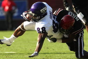 SAN DIEGO - NOVEMBER 7:  Wide receiver Jimmy Young #88 of the Texas Christian University Horned Frogs is tackled after a catch by corner back Larry Parker #7 of the San Diego State Aztecs on November 7, 2009 at Qualcomm Stadium in San Diego, California.    (Photo by Stephen Dunn/Getty Images)
