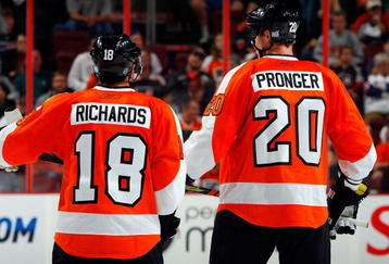 PHILADELPHIA - OCTOBER 22:  Chris Pronger #20 of the Philadelphia Flyers talks with teammate Mike Richards #18 during a time out against the Boston Bruins on October 22, 2009 at Wachovia Center in Philadelphia, Pennsylvania. The Flyers won the game 4-3 after a shootout.  (Photo by Jim McIsaac/Getty Images)