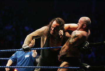 SYDNEY, AUSTRALIA - JUNE 15:  The Undertaker (L) pushes Bam Neely into the corner during WWE Smackdown at Acer Arena on June 15, 2008 in Sydney, Australia.  (Photo by Gaye Gerard/Getty Images)