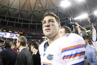 ATLANTA - DECEMBER 5: Quarterback Tim Tebow #15 of the Florida Gators walks off the field dejected as the Alabama Crimson Tide celebrate their 32-13 win during the SEC Championship game at Georgia Dome on December 5, 2009 in Atlanta, Georgia. (Photo by Chris Graythen/Getty Images)