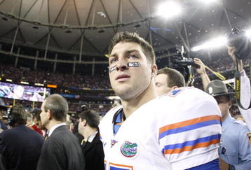 ATLANTA - DECEMBER 5:  Quarterback Tim Tebow #15 of the Florida Gators walks off the field dejected as the Alabama Crimson Tide celebrate their 32-13 win during the SEC Championship game at Georgia Dome on December 5, 2009 in Atlanta, Georgia.  (Photo by Chris Graythen/Getty Images)