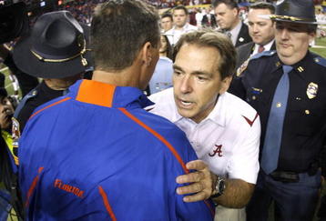 ATLANTA - DECEMBER 5:  Head coach Urban Meyer (L) of the Florida Gators congratulates Nick Saban the Alabama Crimson Tide after Alabama won 32-13 during the SEC Championship game at Georgia Dome on December 5, 2009 in Atlanta, Georgia.  (Photo by Chris Graythen/Getty Images)