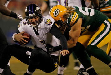 GREEN BAY, WI - DECEMBER 07: Clay Matthews #52 of the Green Bay Packers sacks Joe Flacco #5 of the Baltimore Ravens at Lambeau Field on December 7, 2009 in Green Bay, Wisconsin. The Packers defeated the Ravens 27-17. (Photo by Jonathan Daniel/Getty Images)