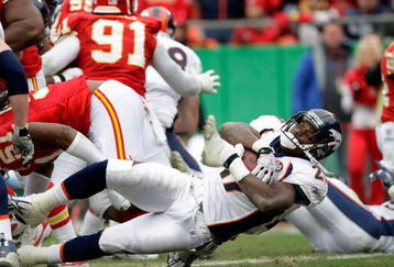 KANSAS CITY, MO - DECEMBER 06:  Knowshonn Moreno #27 of the Denver Broncos falls into the end zone for a touchdwon during the game against the Kansas City Chiefs on December 6, 2009 at Arrowhead Stadium in Kansas City, Missouri.  (Photo by Jamie Squire/Getty Images)