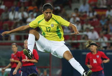 ATHENS - AUGUST 26:  Goalkeeper Briana Scurry of the United States collects the ball while Cristiane of Brazil jumps to avoid her during the women's football gold medal match on August 26, 2004 during the Athens 2004 Summer Olympic Games at Karaiskaki Stadium in Athens, Greece. (Photo by Shaun Botterill/Getty Images)