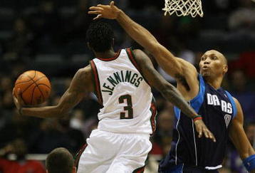 MILWAUKEE - NOVEMBER 16: Brandon Jennings #3 of the Milwuakee Bucks puts up a shot against Shawn Marion #0 of the Dallas Mavericks at the Bradley Center on November 16, 2009 in Milwaukee, Wisconsin. The Mavericks defeated the Bucks 115-113 in overtime. (Photo by Jonathan Daniel/Getty Images)