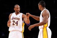 LOS ANGELES, CA - DECEMBER 06:  Kobe Bryant #24 of the Los Angeles Lakers is congratulated by teammate Ron Artest #37 after scoring a basket  against the Phoenix Suns during the first quarter at Staples Center on December 6, 2009 in Los Angeles, California. NOTE TO USER: User expressly acknowledges and agrees that, by downloading and/or using this Photograph, user is consenting to the terms and conditions of the Getty Images License Agreement.  (Photo by Kevork Djansezian/Getty Images)