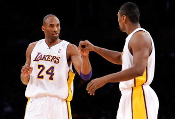 LOS ANGELES, CA - DECEMBER 06:  Kobe Bryant #24 of the Los Angeles Lakers is congratulated by teammate Ron Artest #37 after scoring a basket  against the Phoenix Suns during the first quarter at Staples Center on December 6, 2009 in Los Angeles, California. NOTE TO USER: User expressly acknowledges and agrees that, by downloading and/or using this Photograph, user is consenting to the terms and conditions of the Getty Images License Agreement.  (Photo by Kevork Djansezian/Getty Images)