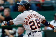ARLINGTON, TX - JULY 29: Center fielder Curtis Granderson #28 of the Detroit Tigers hits his second home run of the game in the second inning against the Texas Rangers on July 29, 2009 at Rangers Ballpark in Arlington, Texas. (Photo by Ronald Martinez/Getty Images)