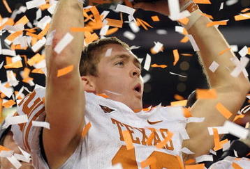 ARLINGTON, TX - DECEMBER 05:  Quarterback Colt McCoy #12 of the Texas Longhorns lifts the Big 12 Championship trophy at Cowboys Stadium on December 5, 2009 in Arlington, Texas.  (Photo by Ronald Martinez/Getty Images)