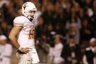 COLLEGE STATION, TX - NOVEMBER 26: Quarterback Colt McCoy #12 of the Texas Longhorns looks on against the Texas A&M Aggies in the second half at Kyle Field on November 26, 2009 in College Station, Texas. The Longhorns defeated the Aggies 49-39. (Photo by Aaron M. Sprecher/Getty Images)