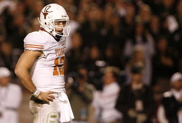 COLLEGE STATION, TX - NOVEMBER 26: Quarterback Colt McCoy #12 of the Texas Longhorns looks on against the Texas A&M Aggies in the second half at Kyle Field on November 26, 2009 in College Station, Texas. The Longhorns defeated the Aggies 49-39. (Photo by Aaron M. Sprecher/Getty Images)