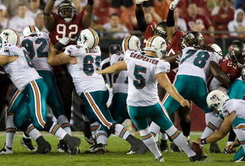 TAMPA, FL - AUGUST 27:  Defensive tackle Dre Moore #92 of the Tampa Bay Buccaneers attempts to block a field goal from kicker Dan Carpenter #5 of the Miami Dolphins during a preseason game at Raymond James Stadium on August 27, 2009 in Tampa, Florida.  (Photo by J. Meric/Getty Images)
