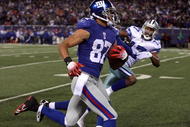 EAST RUTHERFORD, NJ - DECEMBER 06: Domenik Hixon #87 of the New York Giants returns a 79-yard punt return for a touchdown against Sam Hurd #17 of the Dallas Cowboys in the fourth quarter at Giants Stadium on December 6, 2009 in East Rutherford, New Jersey. (Photo by Jim McIsaac/Getty Images)