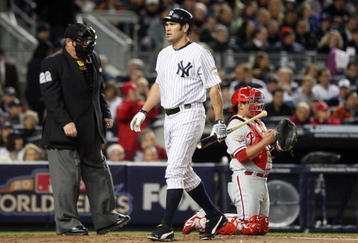 NEW YORK - NOVEMBER 04:  Johnny Damon #18 of the New York Yankees walks back to the dugout after he struck out in the bottom of the first inning against the Philadelphia Phillies in Game Six of the 2009 MLB World Series at Yankee Stadium on November 4, 2009 in the Bronx borough of New York City. The Yankees won 7-3 to win the series 4 games to 2. (Photo by Jed Jacobsohn/Getty Images)