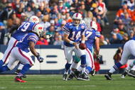ORCHARD PARK, NY - NOVEMBER 29: Quarterback Ryan Fitzpatrick #14 of the Buffalo Bills moves to hand off the ball during the game against the Miami Dolphins at Ralph Wilson Stadium on November 29, 2009 in Orchard Park, New York. Buffalo won 31-14. (Photo by Rick Stewart/Getty Images)