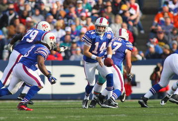 ORCHARD PARK, NY - NOVEMBER 29:  Quarterback Ryan Fitzpatrick #14 of the Buffalo Bills moves to hand off the ball during the game against the Miami Dolphins at Ralph Wilson Stadium on November 29, 2009 in Orchard Park, New York. Buffalo won 31-14. (Photo by Rick Stewart/Getty Images)