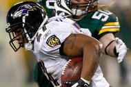 GREEN BAY, WI - DECEMBER 7: Running back Ray Rice #27 of the Baltimore Ravens runs with the football as he is pursued by linebacker A.J. Hawk #50 of the Green Bay Packers at Lambeau Field on December 7, 2009 in Green Bay, Wisconsin. The Packers defeated the Ravens 27-17. (Photo by Scott Boehm/Getty Images)