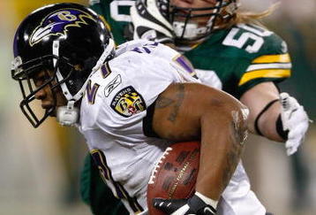 GREEN BAY, WI - DECEMBER 7: Running back Ray Rice #27 of the Baltimore Ravens runs with the football as he is pursued by linebacker A.J. Hawk #50 of the Green Bay Packers at Lambeau Field on December 7, 2009 in Green Bay, Wisconsin. The Packers defeated the Ravens 27-17. (Photo by Scott Boehm/Getty Images)