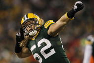 GREEN BAY, WI - DECEMBER 7: Clay Matthews #52 of the Green Bay Packers celebrates after he sacked Joe Flacco #5 of the Baltimore Ravens in the first half at Lambeau Field on December 7, 2009 in Green Bay, Wisconsin. (Photo by Jonathan Daniel/Getty Images)
