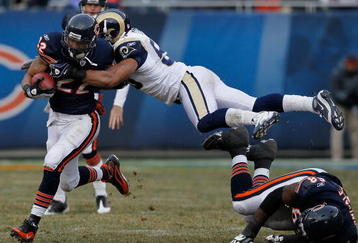 CHICAGO - DECEMBER 06: Paris Lenon #53 of the St. Louis Rams leaps over Frank Omiyale #68 of the Chicago Bears to try and tackle Matt Forte #22 at Soldier Field on December 6, 2009 in Chicago, Illinois. The Bears defeated the Rams 17-9. (Photo by Jonathan Daniel/Getty Images)