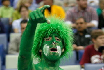 NEW ORLEANS - MARCH 16:  A fan of the North Texas Mean Green cheers for the team over the Memphis Tigers during round one of the NCAA Men's Basketball Tournament at the New Orleans Arena on March 16, 2007 in New Orleans, Louisiana.  (Photo by Chris Graythen/Getty Images)