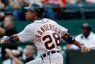 ARLINGTON, TX - JULY 29:  Center fielder Curtis Granderson #28 of the Detroit Tigers hits his second home run of the game in the second inning against the Texas Rangers on July 29, 2009 at Rangers Ballpark in Arlington, Texas.  (Photo by Ronald Martinez/Getty Images)